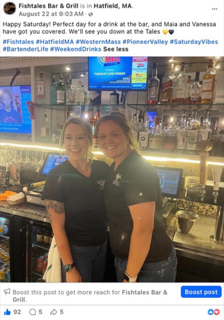 Fishtales Bar and Grill post by Logan Graves, two employees behind the bar