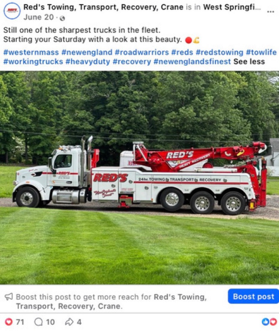 Red's Towing post by Logan Graves, a tow truck parked on grass